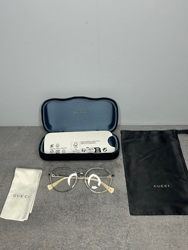 Gucci GG1145O – Złote Oprawki Optyczne z Kremowymi Zausznikami