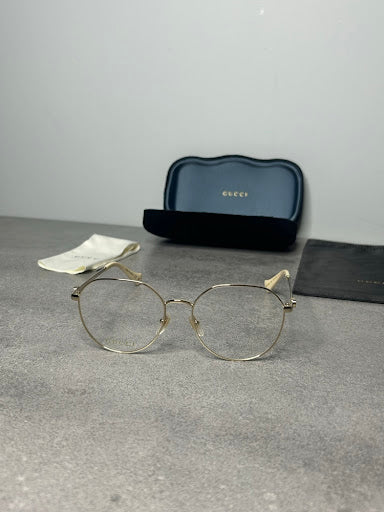 Gucci GG1145O – Złote Oprawki Optyczne z Kremowymi Zausznikami
