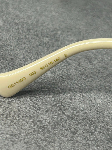 Gucci GG1145O – Złote Oprawki Optyczne z Kremowymi Zausznikami